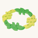 Grimm's Dark Green and Light Green Branches set up in a ring on a plain background.