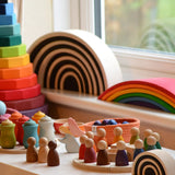 Grimms handcrafted wooden rainbow bridges in a display with other popular Grimms wooden block sets