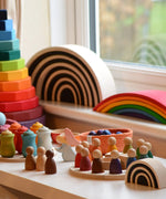 Grimms handcrafted wooden rainbow bridges in a display with other popular Grimms wooden block sets