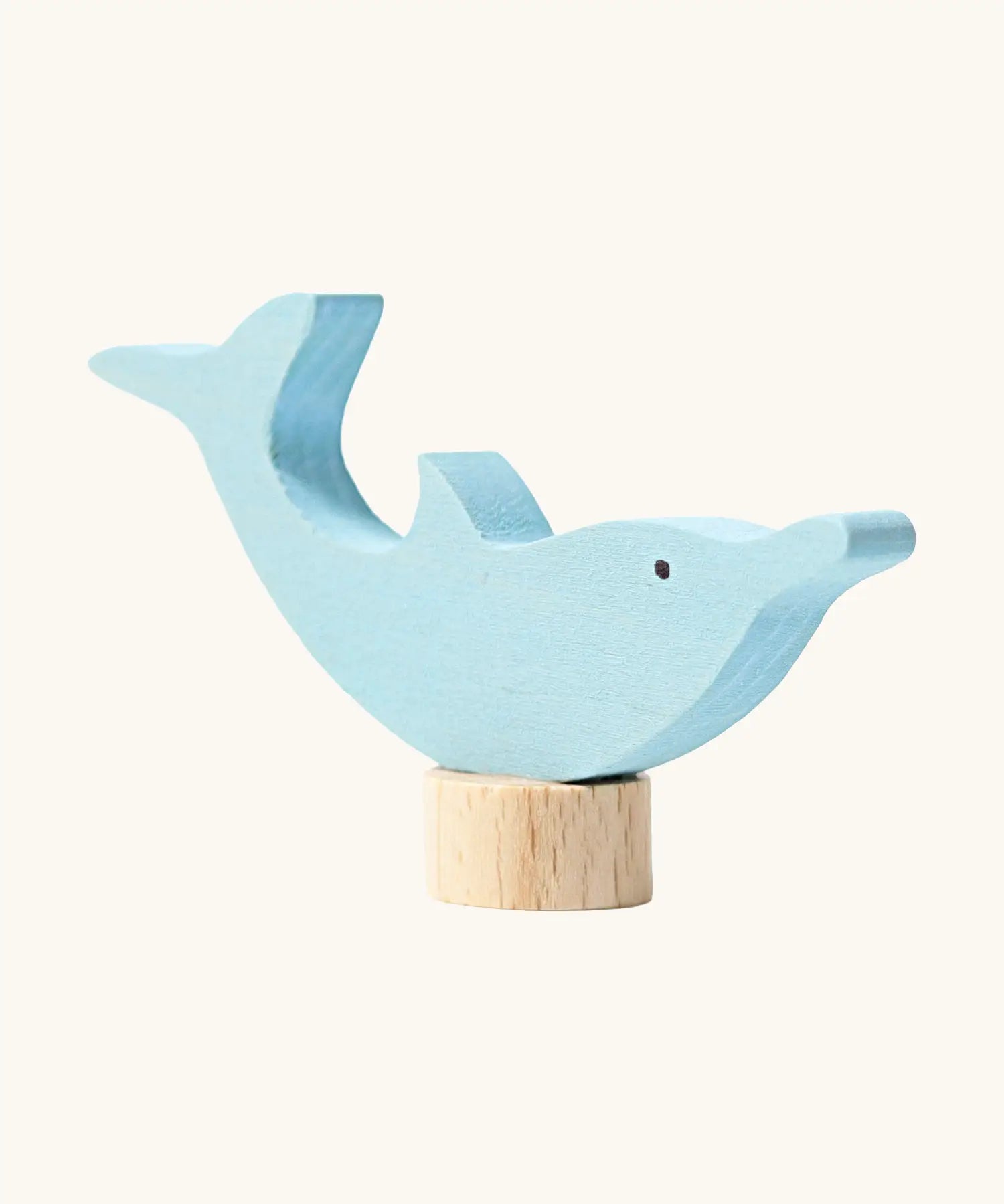 Front of Grimm's handcrafted wooden dolphin decorative figure showing hand painted eyes