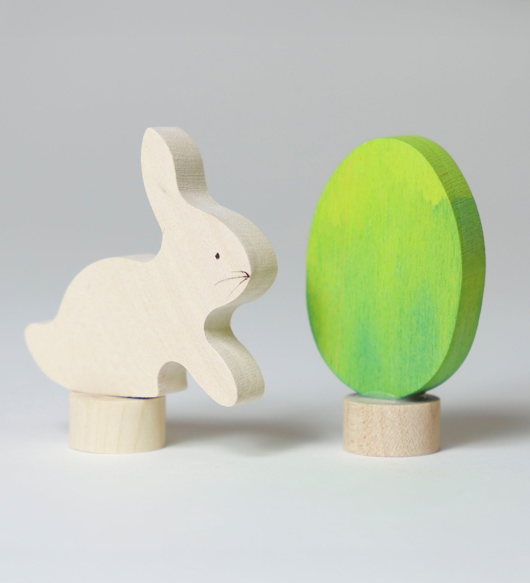 Grimm's Easter Decorative Figure Set featuring a white bunny rabbit a Batik Green coloured eggs. 