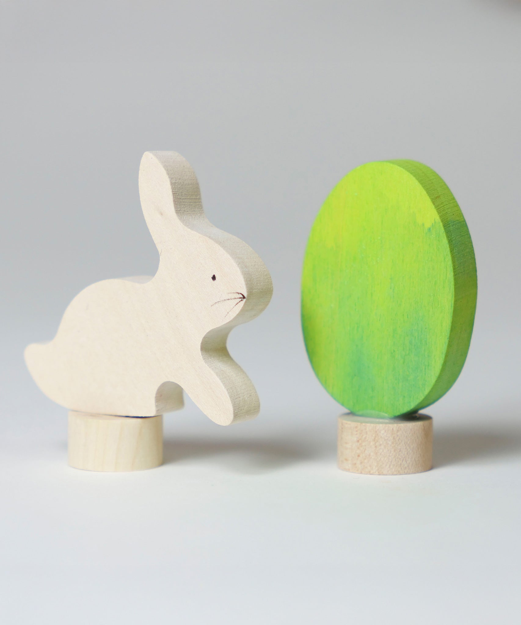 Grimm's Easter Decorative Figure Set featuring a white bunny rabbit a Batik Green coloured eggs. 