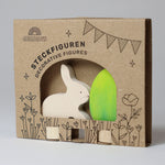 Grimm's Easter Decorative Figure Set featuring a white bunny rabbit a Batik Green coloured eggs. The figures are shown in their cardboard packaging 