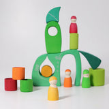 A playscene made from the green Grimms fairytale village blocks and peg dolls