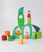 A playscene made from the green Grimms fairytale village blocks and peg dolls