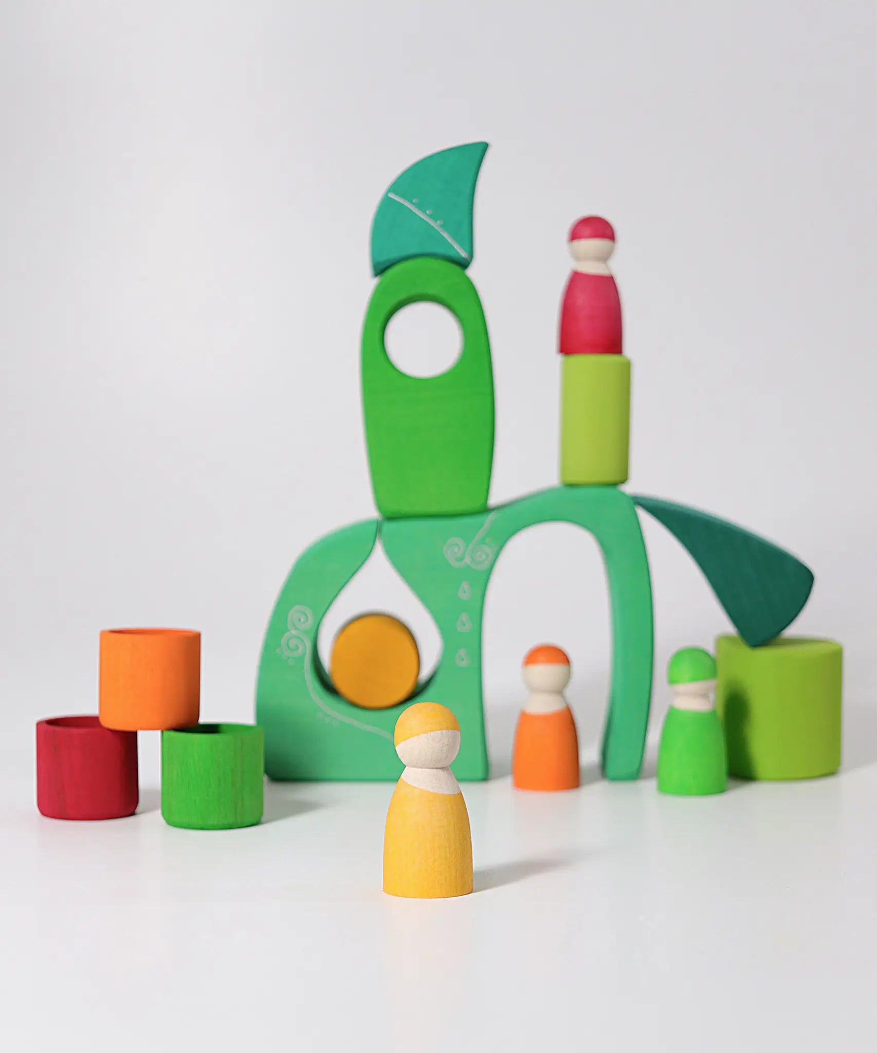 A playscene made from the green Grimms fairytale village blocks and peg dolls