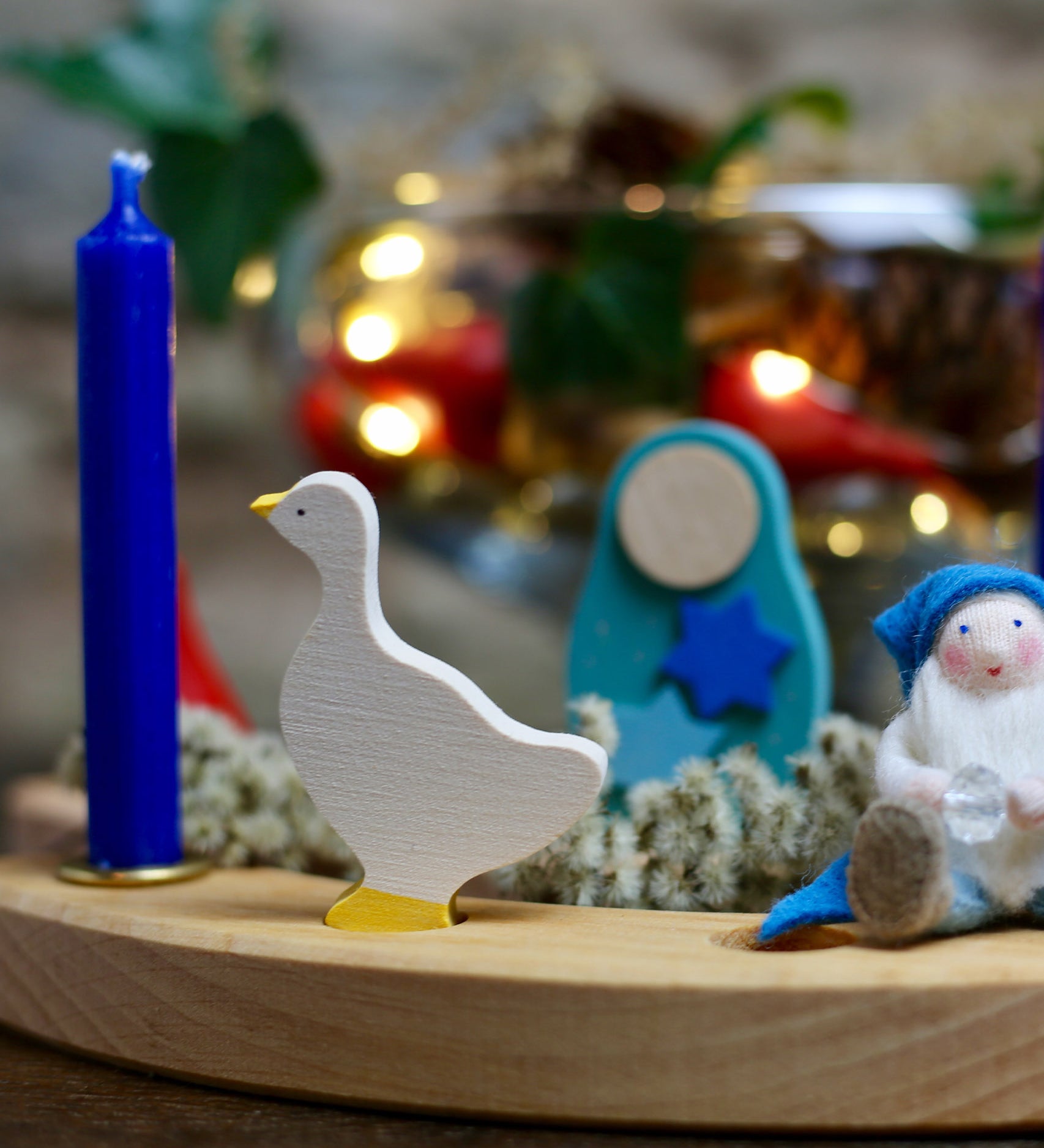 A Winter inspired display using a Grimm's Waldorf Celebration Ring, various Grimm's decorative figures, Grimm's blue Candles and a Ambrosius doll available at Babipur.