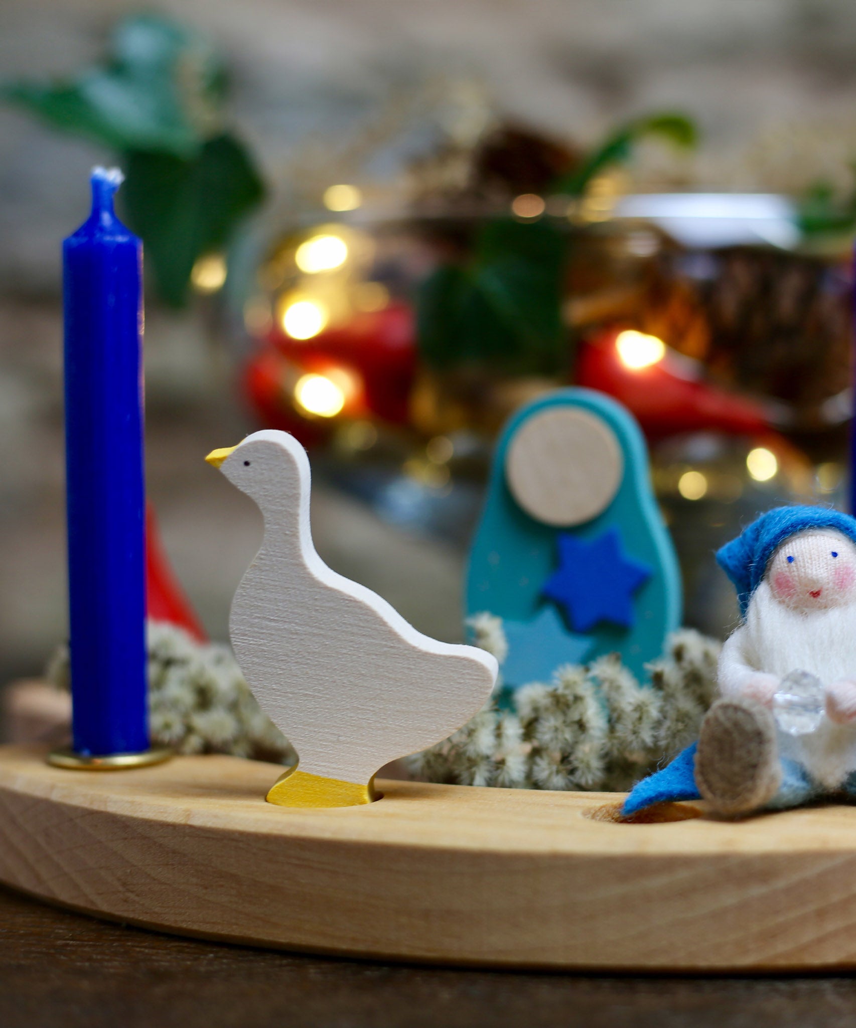 A Winter inspired display using a Grimm's Waldorf Celebration Ring, various Grimm's decorative figures, Grimm's blue Candles and a Ambrosius doll available at Babipur.