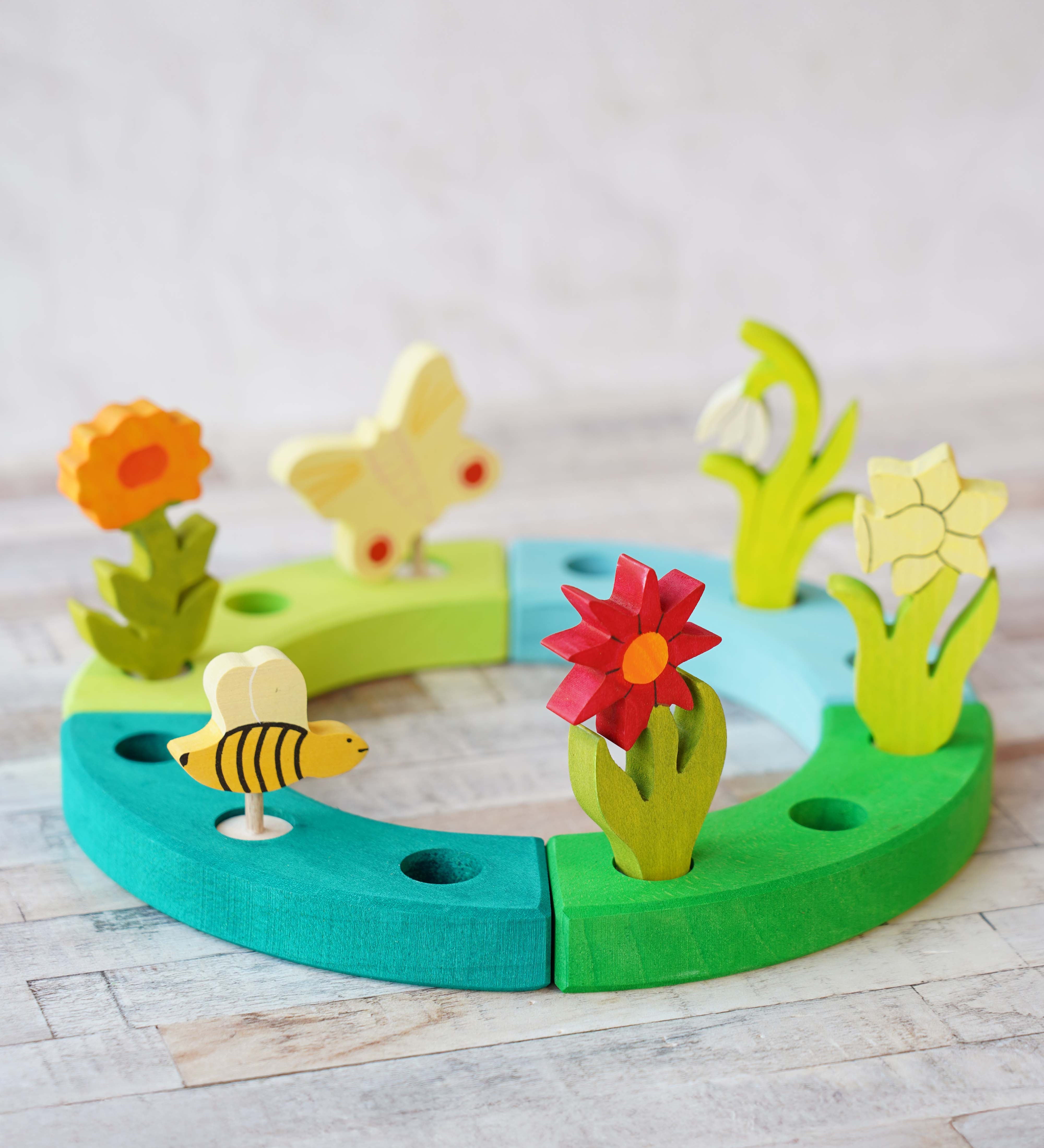 A beautiful Spring inspired  display using a Grimm's Waldorf Celebration Ring and various decorative figures available at Babipur.