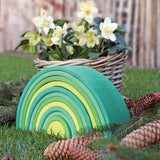 A autumnal display using the Grimms forest large wooden rainbow 12 piece set available at Babipur with various woodland pieces.