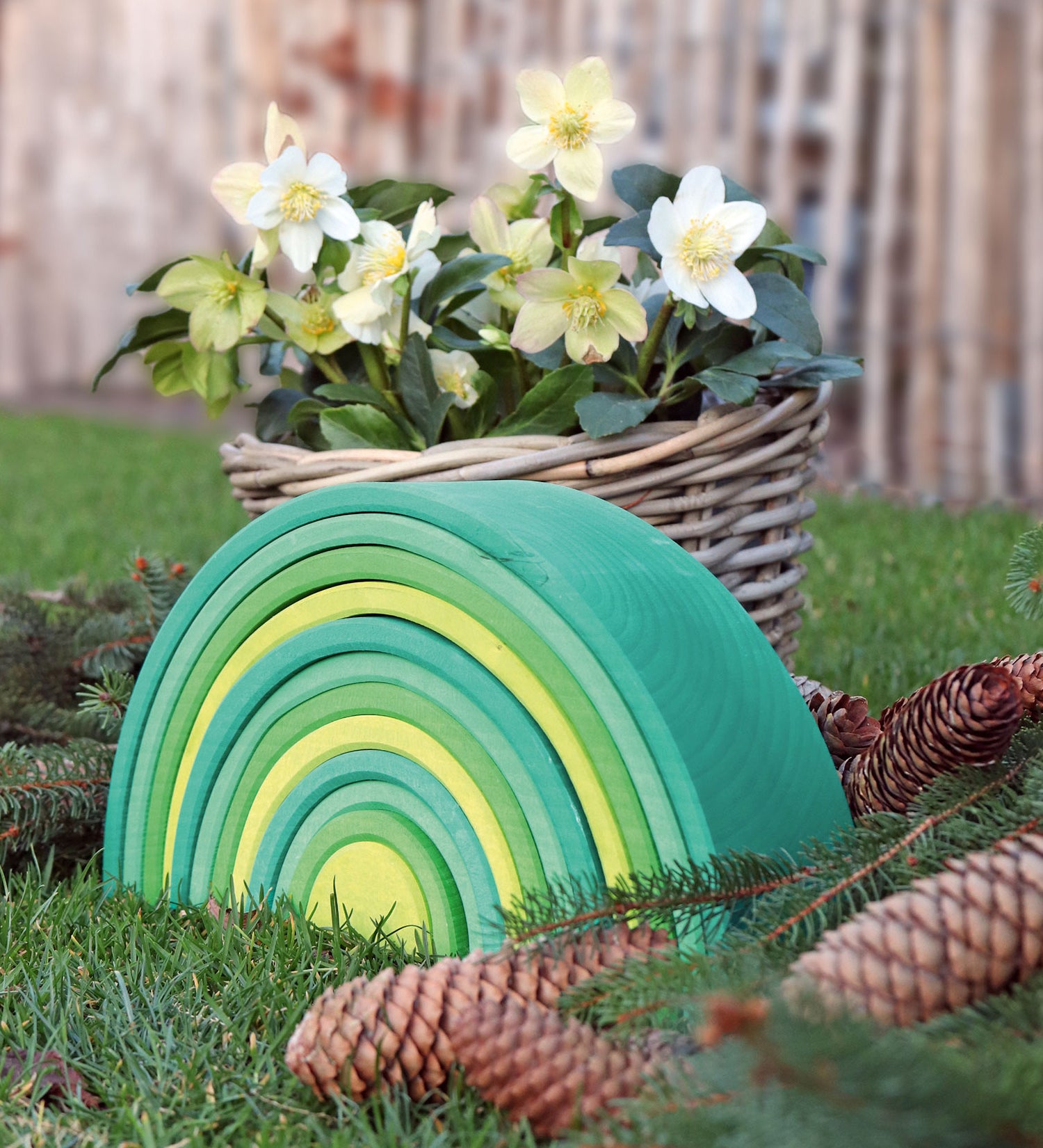 A autumnal display using the Grimms forest large wooden rainbow 12 piece set available at Babipur with various woodland pieces.