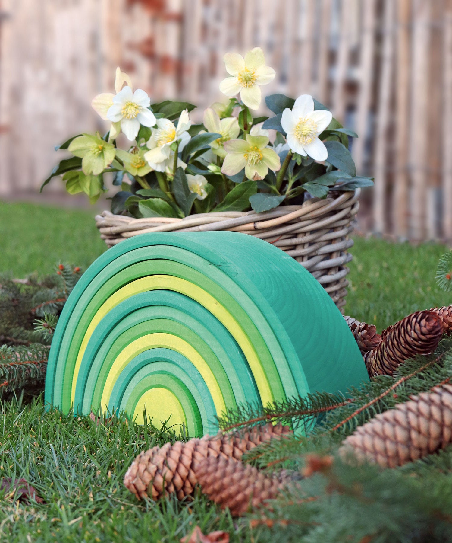 A autumnal display using the Grimms forest large wooden rainbow 12 piece set available at Babipur with various woodland pieces.