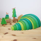 A cute little display using the Grimms forest large green wooden rainbow and various Ostheimer woodland animal figures, all available at Babipur.