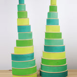 2 tall shelf stacks made from the forest and meadow Grimms wooden rainbow sets with natural semi circles. These sets are available at Babipur.