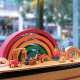Grimm's Giant Rainbow shown on display in a shop with other toys.