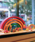 Grimm's Giant Rainbow shown on display in a shop with other toys.