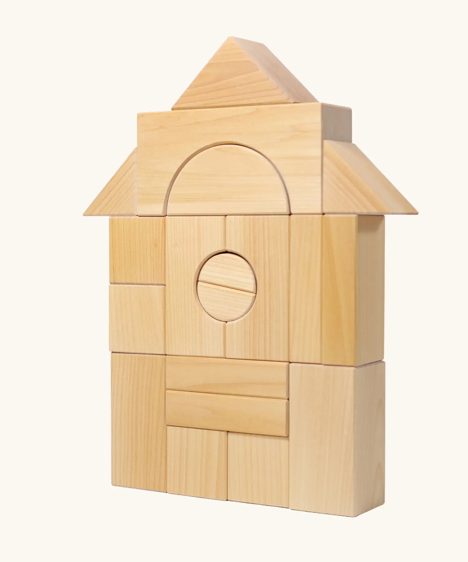 Grimm's giant natural wooden building blocks set used to create a house structure.