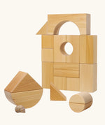 Grimm's giant natural wooden building blocks set used to create a boat shape.
