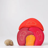 Grimm's gnome house wooden stacking toy. 4 piece red and orange wooden block puzzle.