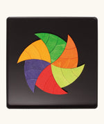A abstract swirl made from the Grimm's bright wooden Goethe magnetic pieces displayed in a tin 