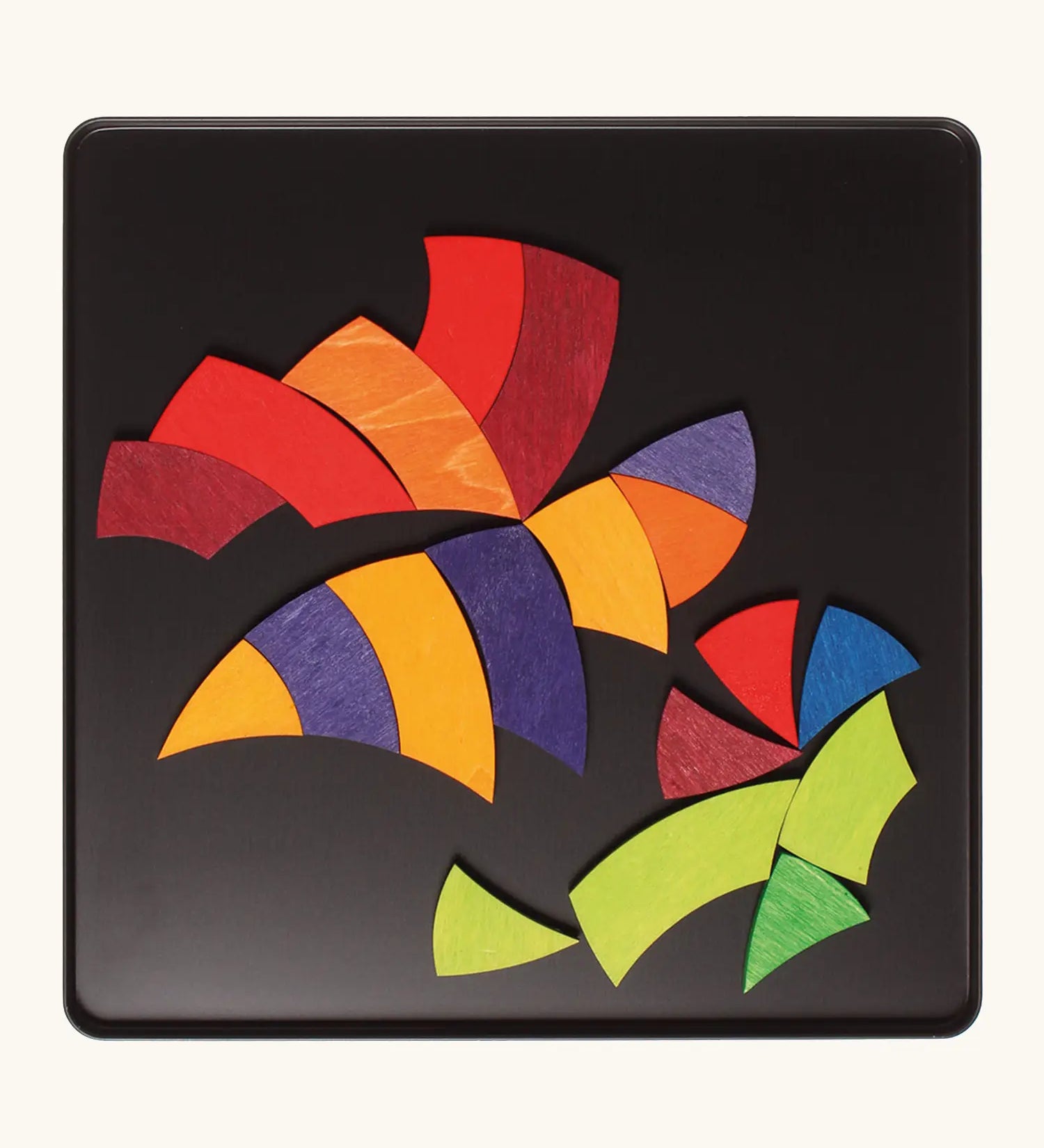 A bee in flight made from the Grimm's bright wooden Goethe magnetic pieces displayed in a tin 