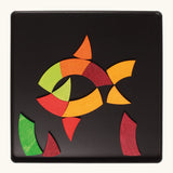 A fish made from the Grimm's bright wooden Goethe magnetic pieces displayed in a tin 