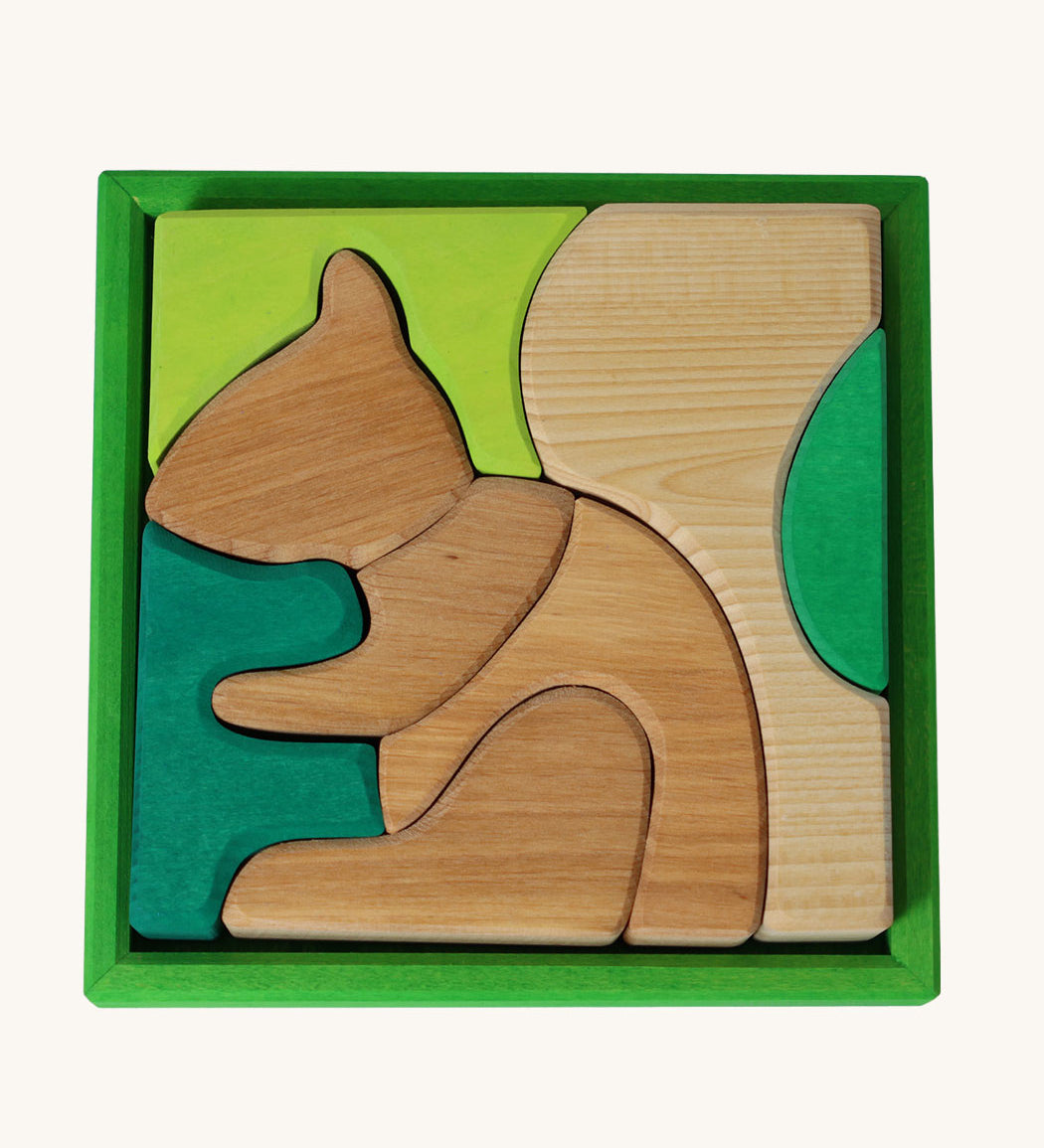 Grimm's green squirrel building set. A set of green and natural wooden blocks that form a shape of a squirrel when placed into the green coloured wooden storage tray. These Grimm's toys are part of a wide range of wooden toys available here at Babipur. 