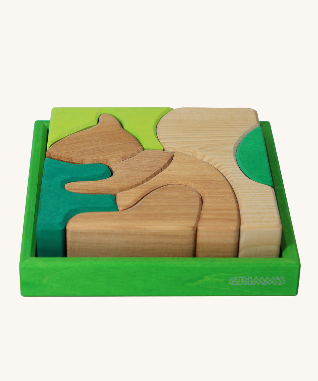 Grimm's green squirrel building set. A set of green and natural wooden blocks that form a shape of a squirrel when placed into the green coloured wooden storage tray. These Grimm's toys are part of a wide range of wooden toys available here at Babipur. 