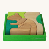 Grimm's green squirrel building set. A set of green and natural wooden blocks that form a shape of a squirrel when placed into the green coloured wooden storage tray. These Grimm's toys are part of a wide range of wooden toys available here at Babipur. 