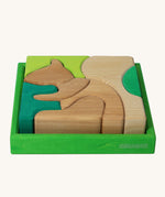 Grimm's green squirrel building set. A set of green and natural wooden blocks that form a shape of a squirrel when placed into the green coloured wooden storage tray. These Grimm's toys are part of a wide range of wooden toys available here at Babipur. 
