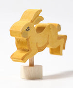 Front of Grimm's handcrafted wooden jumping rabbit decorative figure showing hand painted facial features
