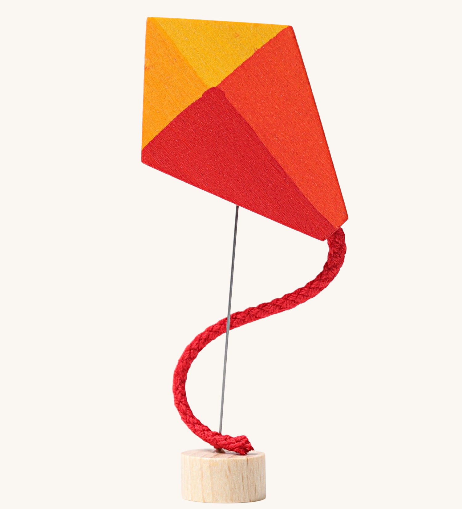 Grimm's Kite Decorative Figure, a red orange and yellow coloured kite to fit onto the Grimm's celebration ring. These Waldorf inspired decorative figures are part of a wide range of wooden decorations for celebration rings available here at Babipur. 
