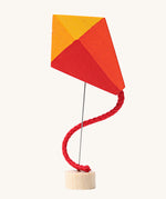 Grimm's Kite Decorative Figure, a red orange and yellow coloured kite to fit onto the Grimm's celebration ring. These Waldorf inspired decorative figures are part of a wide range of wooden decorations for celebration rings available here at Babipur. 