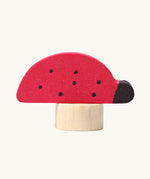 Grimm's handcrafted wooden ladybird decorative figure with a unpainted stand