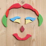 Grimm's Lara Mandala Building Set blocks used to create a face shape.