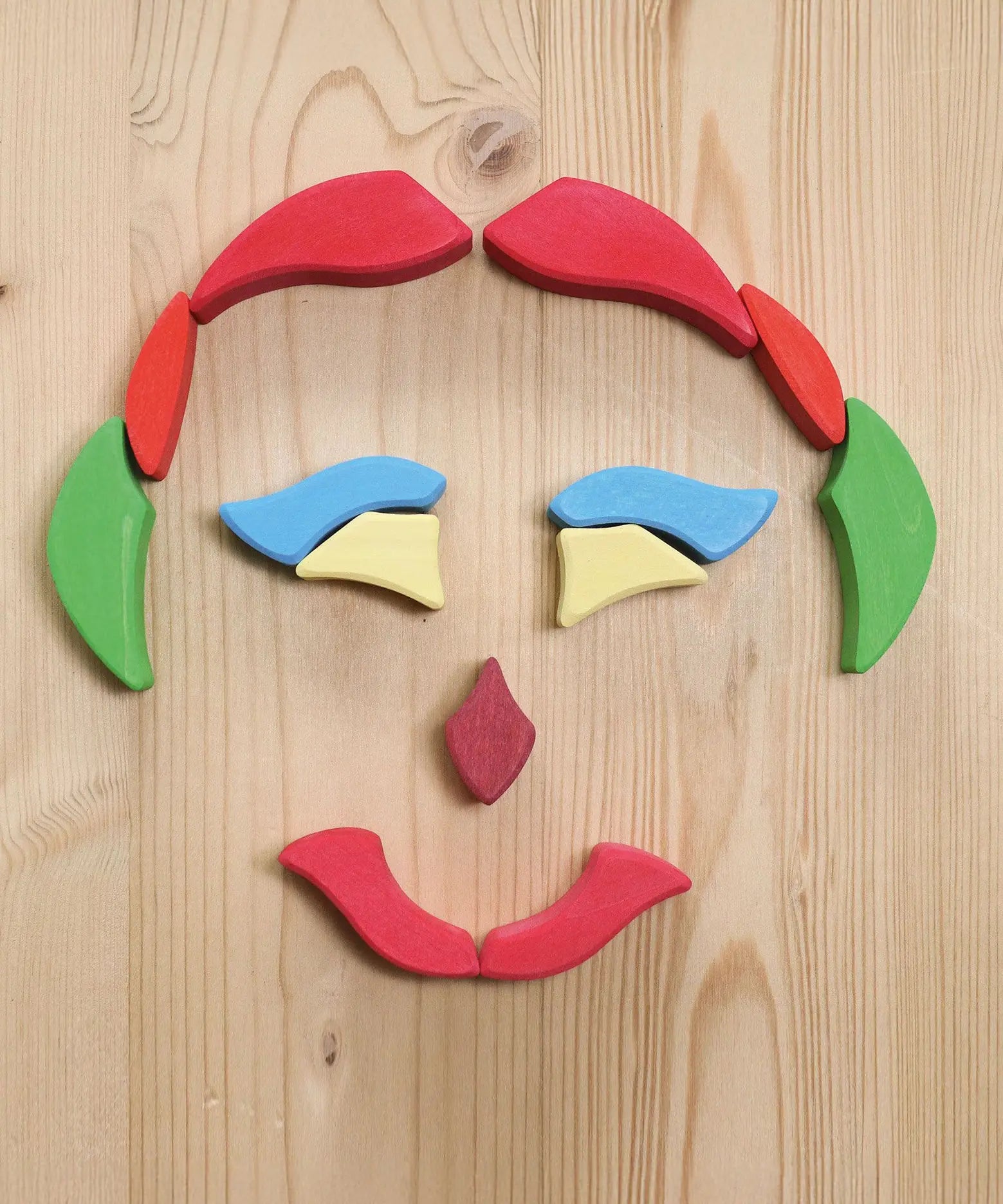 Grimm's Lara Mandala Building Set blocks used to create a face shape.