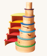 The Grimm's Large Natural Rainbow stacked up with the rainbow semi circles. 