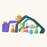 Earth elements from the Grimm's Large 4 Elements wooden Building Set used in a small world play set up with Grimm's friends and cars.