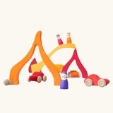 Fire elements from the Grimm's Large 4 Elements wooden Building Set used in a small world play set up with Grimm's friends and cars.
