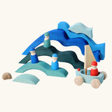 Water elements from the Grimm's Large 4 Elements wooden Building Set used in a small world play set up with Grimm's friends and boats.