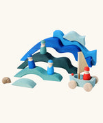 Water elements from the Grimm's Large 4 Elements wooden Building Set used in a small world play set up with Grimm's friends and boats.