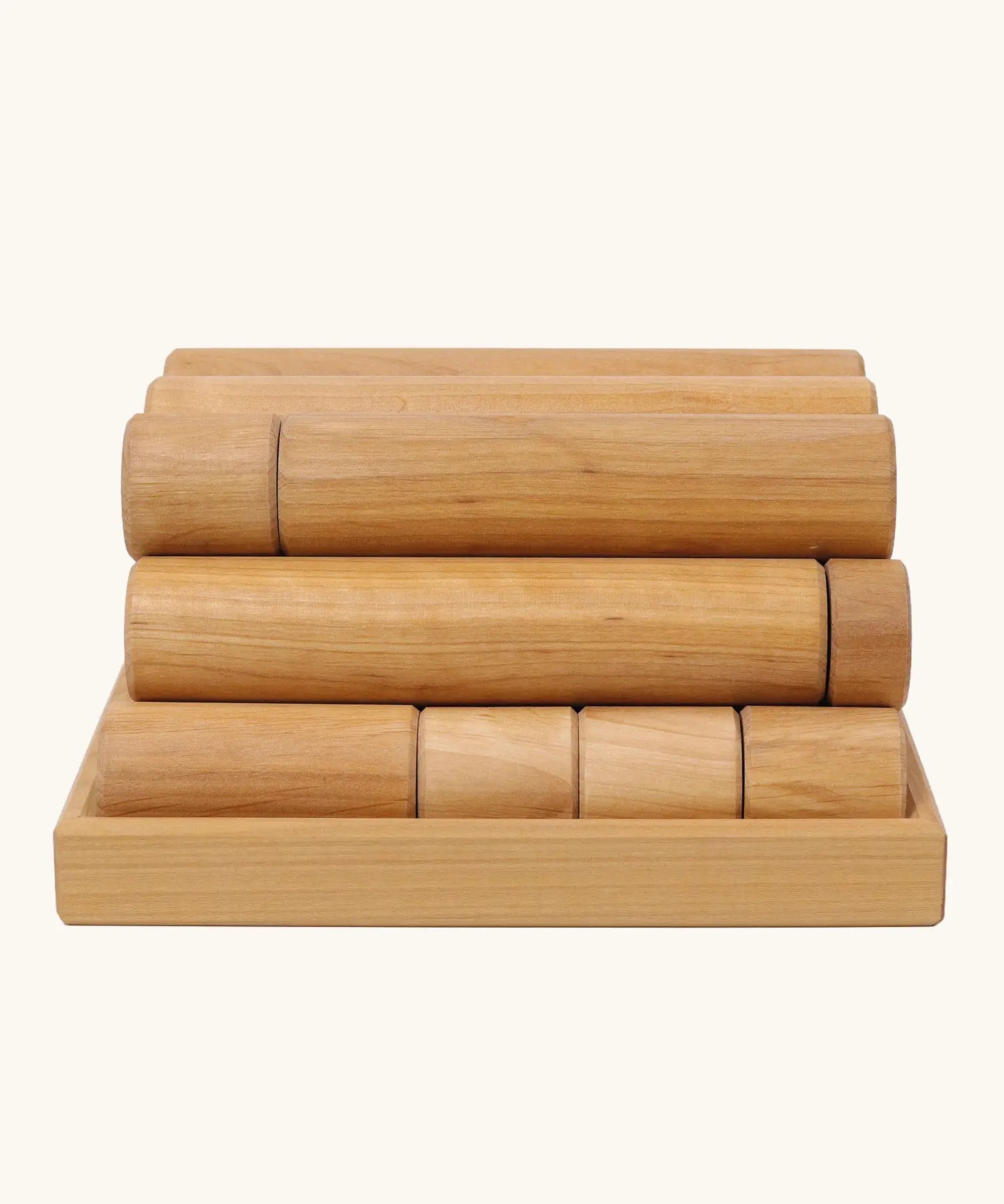 Side view of the Grimm's large wooden building rollers in natural in a tray.