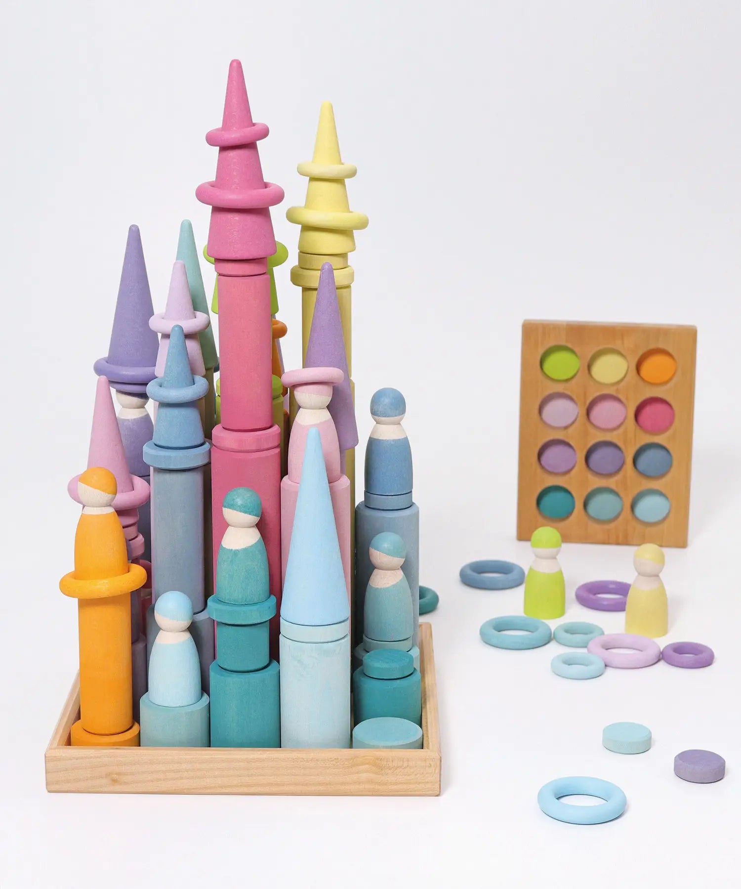 Grimm's large building rollers pastel in a wooden storage tray.