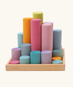 Grimm's large building rollers pastel in a wooden storage tray.