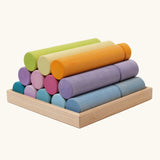 Grimm's large building rollers pastel in a wooden storage tray.