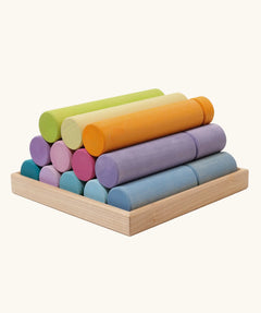Grimm's large building rollers pastel in a wooden storage tray.