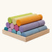 Grimm's large building rollers pastel in a wooden storage tray.