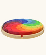 Grimm's Large Colour Spiral in a wooden tray, side view.