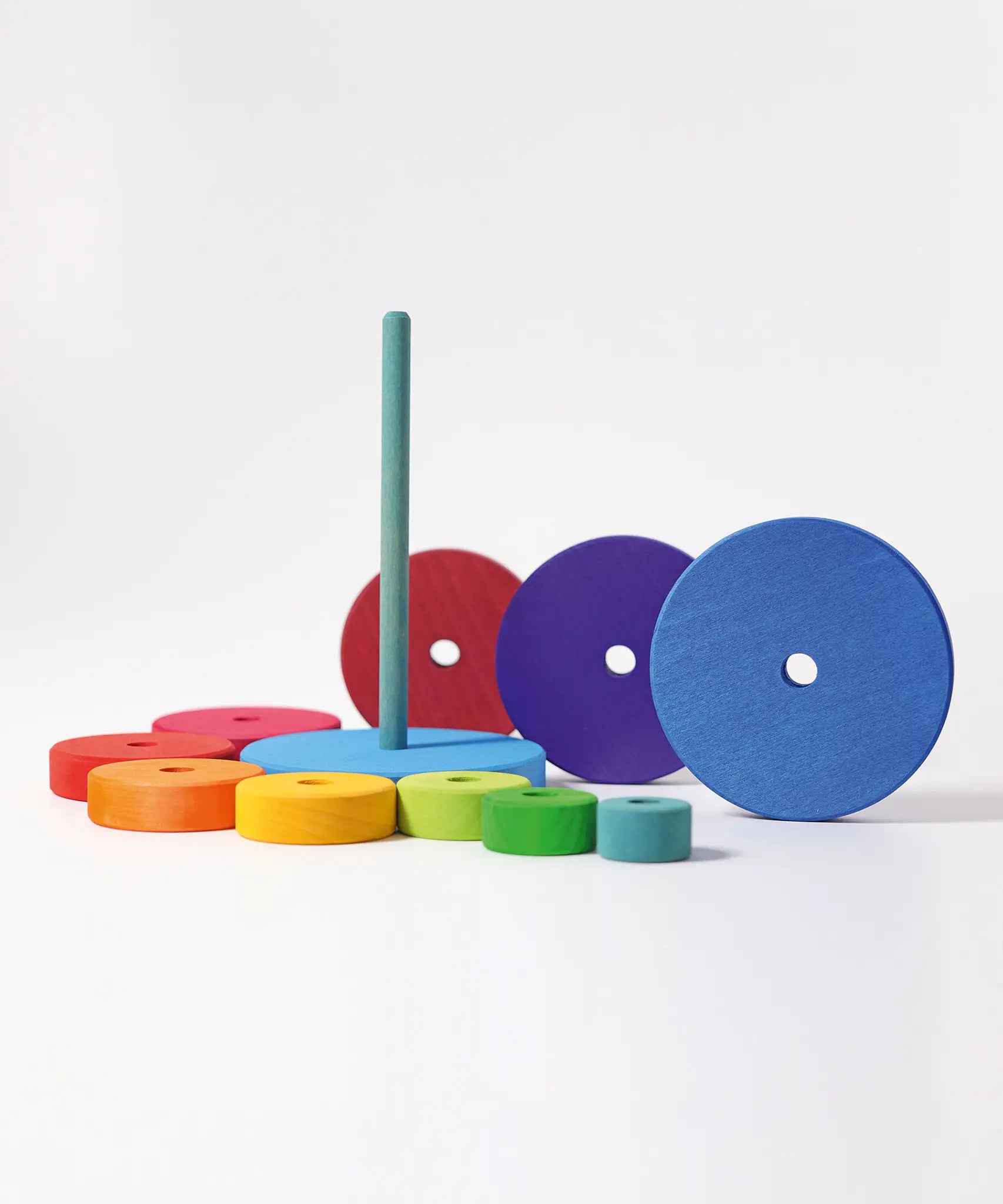 Grimms large conical tower showing loose disk pieces and base in a Grimm’s World of Numbers palette