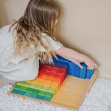 Child sorting the blocks from the Grimms large stepped wooden counting set